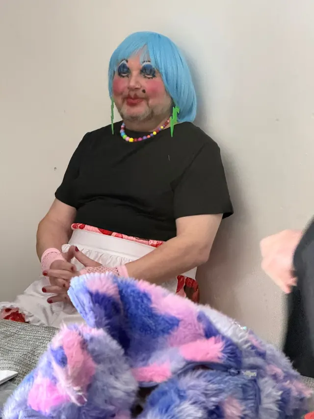 Costumed performer backstage