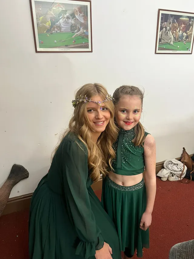 Two costumed cast members together